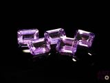 purple amethorate cubes on a black background