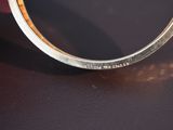 a close up of a ring with a diamond on it
