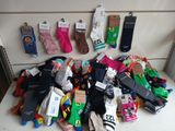 many pairs of socks that are on a table