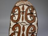 a close up of a decorative object on a white surface