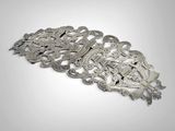 a close up of a metal object on a white surface