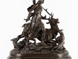 une image représentant une statue en bronze d'une femme et d'un cerf