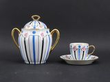 an image of a tea pot and cup sitting on a table