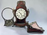 a clock that is sitting on a table next to a mirror