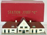 a small model of a building with a red box on top of it