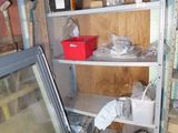 a room that has a refrigerator and shelves in it