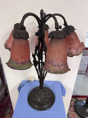 a lamp that is sitting on a table with a blue table cloth