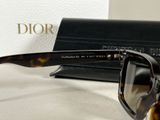a pair of sunglasses sitting on a table next to a wallet