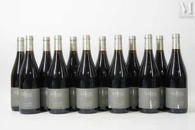 six bottles of wine are lined up in a row