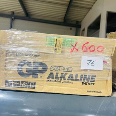 a box of batteries sitting on a table in a warehouse