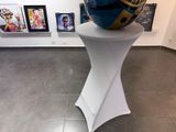a sculpture of a helmet on a pedestal in a room