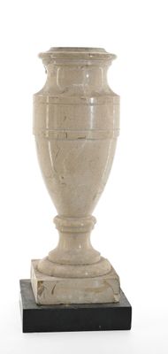 a vase that is sitting on a stand on a white background
