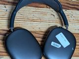 an image of a pair of headphones sitting on top of a wooden table