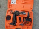 a tool kit in the orange case on the floor