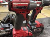 a couple of tools sitting on top of a table next to each other