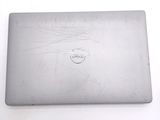 a laptop with a cracked screen sitting on a table