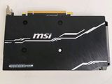 a close up of a black and white graphics card on a white surface
