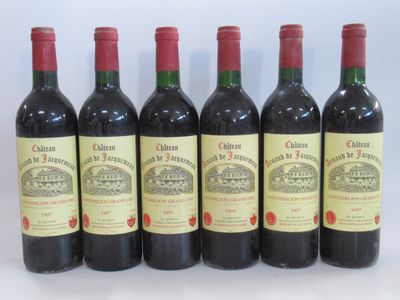 six bottles of red wine lined up in a row