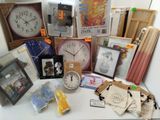 many items that are on a table with a clock