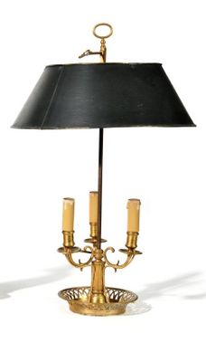 a table lamp that has a black shade on top of it