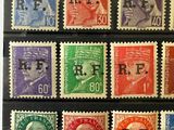 a close up of a group of stamps on a black surface