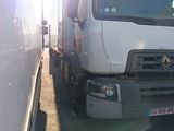 a truck that is parked next to a wall