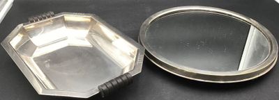 a small mirror sitting on top of a table next to a mirror