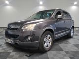 a picture of a dark colored suv parked in a room