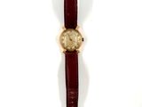 an image of a close up of a wrist watch on a white surface