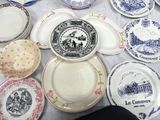 many plates that are on a table with blue and white designs