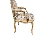 an image of a chair with a floral upholstered back