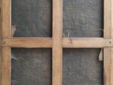 an old wooden window with a glass pane in it