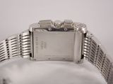 a close up of a wrist watch on a white surface