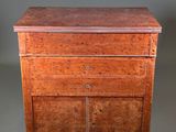 an old wooden cabinet with two drawers and two doors