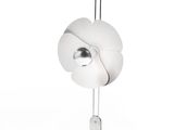 a white lamp that is on a stand on a white surface