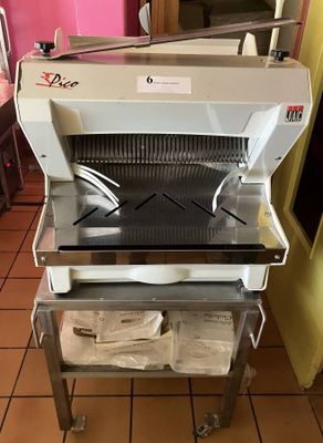 a machine that is sitting on a cart in the kitchen