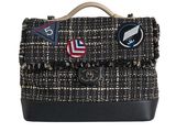 this image may contain a handbag or a purse with patches on it
