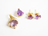a close up of a pair of earrings and a pair of earrings
