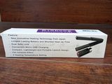 an open box of a hair straightener sitting on top of a wooden table
