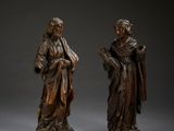une paire de statues en bronze représentant un homme et une femme