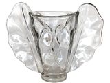 a clear glass vase with a leaf design on it
