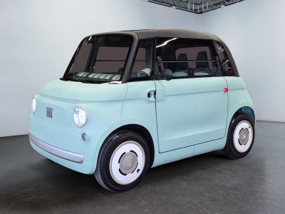 a small blue car that is sitting in a room