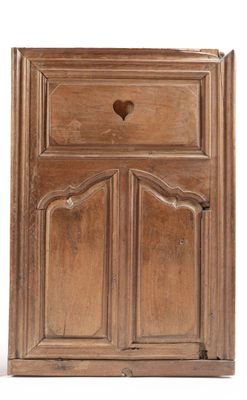 an image of a wooden cabinet with a heart on the door