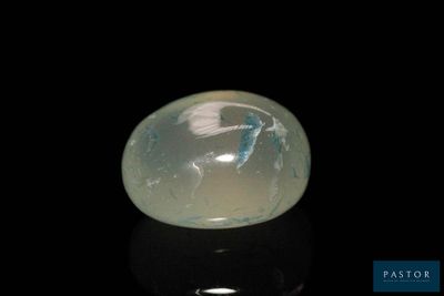 an image of a white jade stone on a black surface
