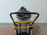 an image of a vacuum cleaner is sitting on the floor