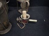 two old metal items that are sitting on the floor