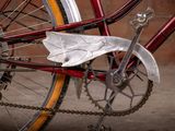 a close up of a bike with a chain attached to it