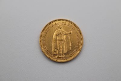 an image of a gold coin with the image of a man holding a sword