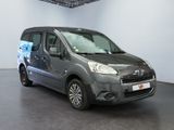 grey citrole van parked in a showroom in a showroom