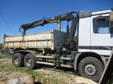 a large truck with a crane on the back of it